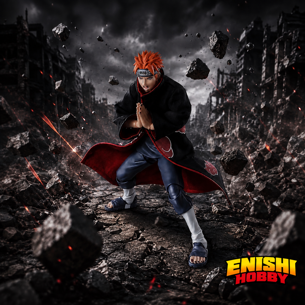 NARUTO Shippuden Pain Tendo figure in a crouched pose with palms together, against a ruined city backdrop with floating rocks.
