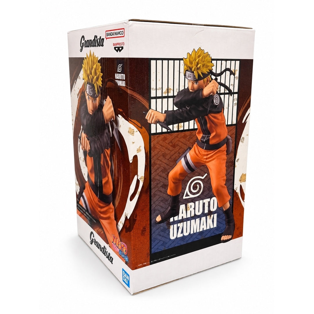 Angled front and side view of the NARUTO Shippuden Grandista box featuring Naruto in a wide battle stance and Hidden Leaf symbols.